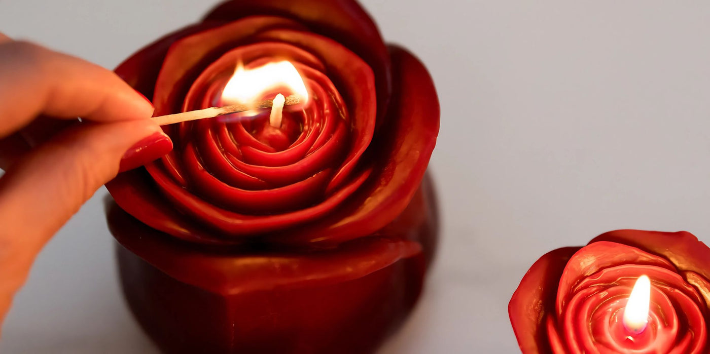 Red Grande Rose Candle with person lighting it